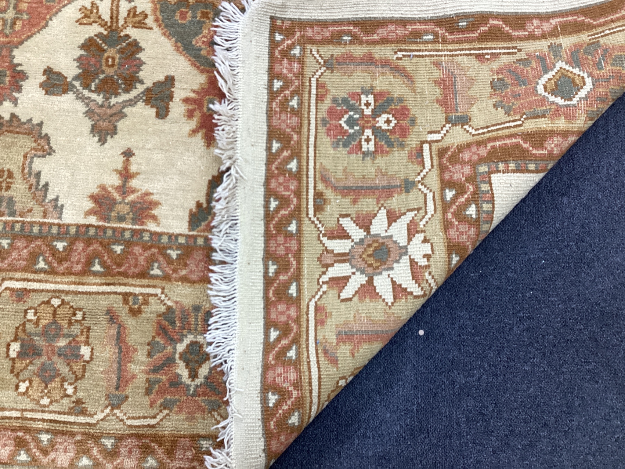 A Turkish ivory ground carpet, 320 x 170cm